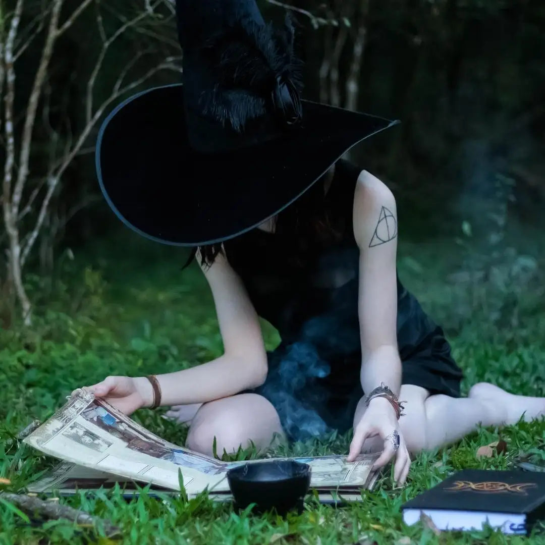 Black witch hat with feather trim