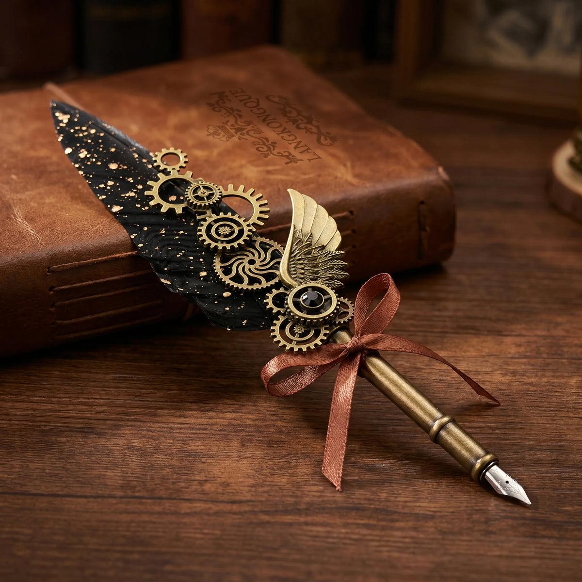 Black steampunk feather quill pen with decorative gears, a wing ornament and ribbon bow
