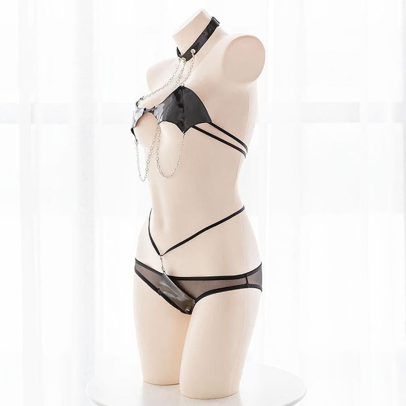Black bat wing costume set featuring a black latex and mesh lingerie set with silver chain accents