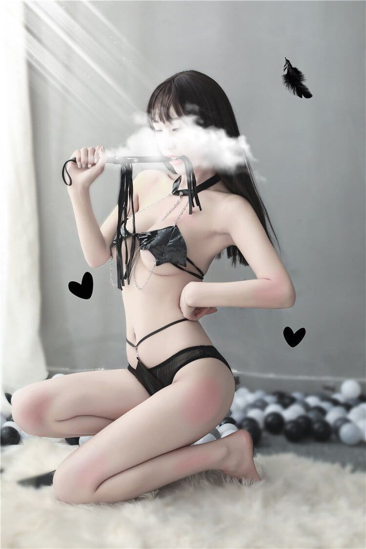 Black lace lingerie set with thin straps and matching choker in a black bat wing costume set
