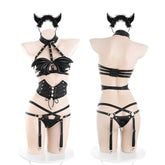 All black, bat wings, and plenty of gothic attitude. This wing lingerie set combines a sculpted wing-shaped top,