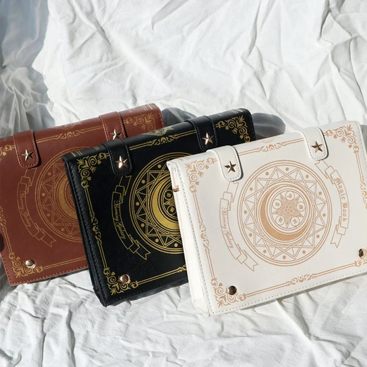 Black Brown and Beige gothic spellbook bags with ornate front artwork