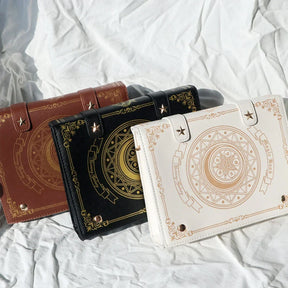 Black Brown and Beige gothic spellbook bags with ornate front artwork