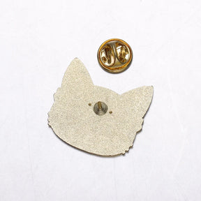 Reverse of a cat-shaped pin with a single post and a detached gold-tone butterfly clutch on a white background.