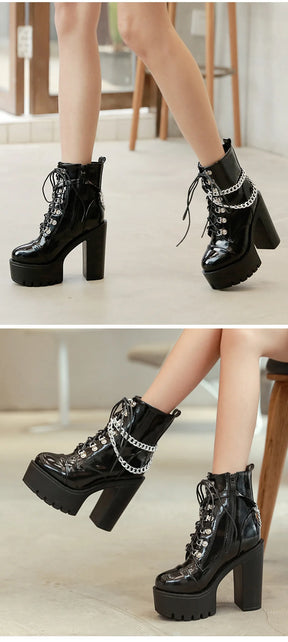 Two stacked photographs of the black chain boots worn standing and seated, showing the tall heels and notched platforms.