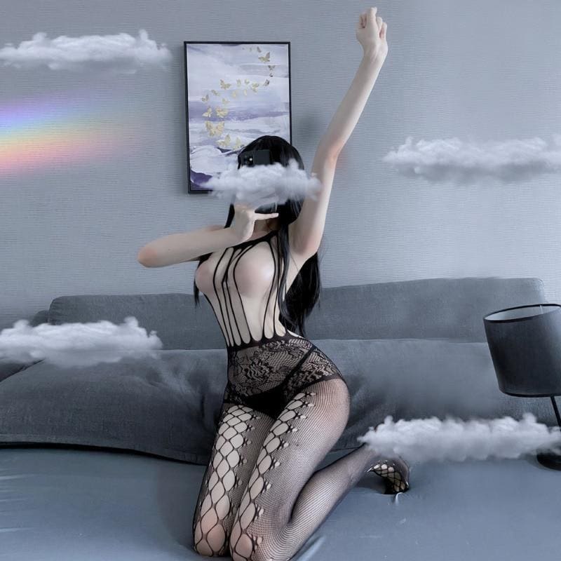 Front view of the sleeveless black bodystocking with one arm raised, showing the rounded neckline and long cutout strips.