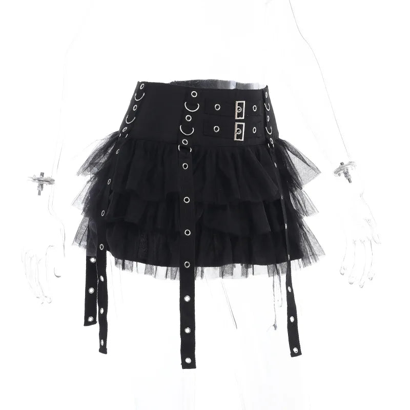 Angled clear-mannequin view of the black ruffle skirt, showing the layered mesh and long eyelet straps below the hem.