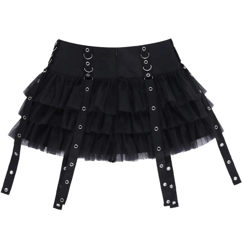 Rear flat view of the black ruffle mini skirt, showing the back waistband, mesh tiers and long eyelet straps.
