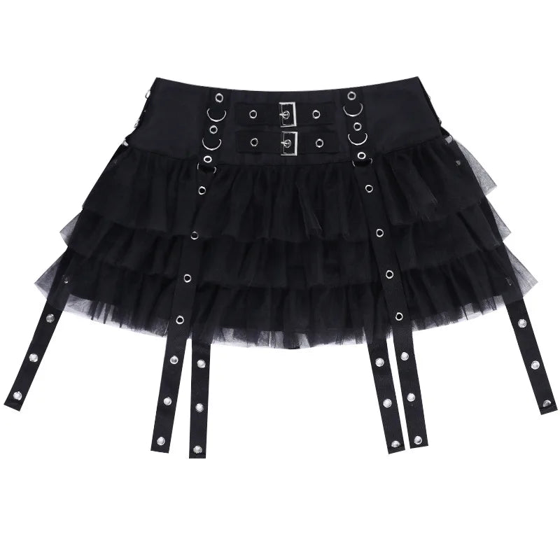Front product view of the black eyelet strap mini skirt laid flat on white, with the ruffles and straps spread out.