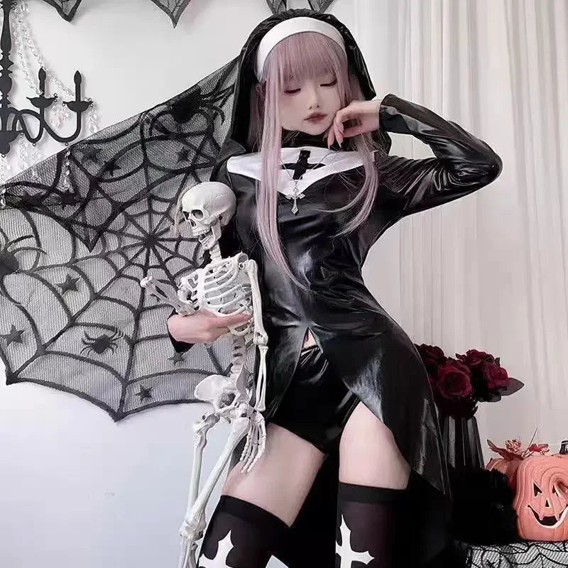 Front view of a glossy black nun cosplay dress with a white chest panel and black cross. The model wears the matching veil and holds a skeleton prop.
