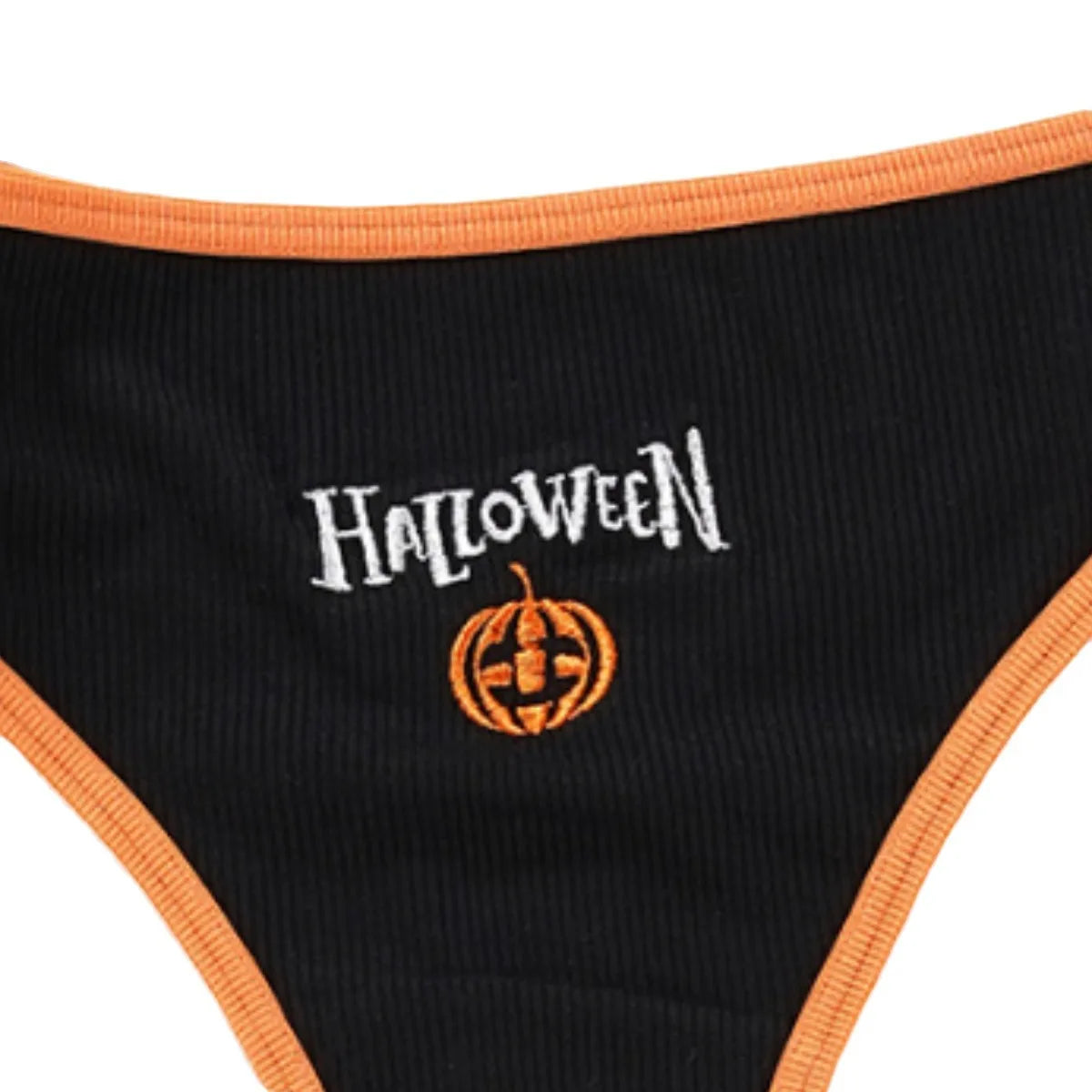 Close-up of white Halloween lettering and an orange pumpkin motif on the black ribbed thong front.