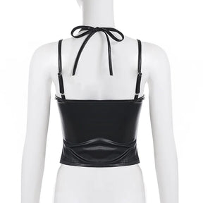 Rear mannequin view of the black crop top, showing shoulder-strap sliders, the tied halter neck and plain back panel.