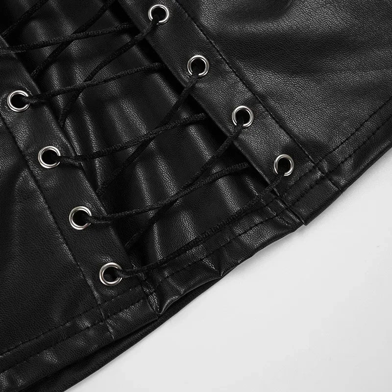 Lower front detail of the black lace-up top, showing eyelets, crossed cords and the stitched cropped hem.