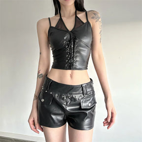 Front outfit view of the black mesh halter top with glossy black shorts, showing the fitted waist and laced front.