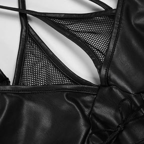 Close-up of the black top's sheer mesh panels surrounding the narrow keyhole opening and edged with glossy trim.