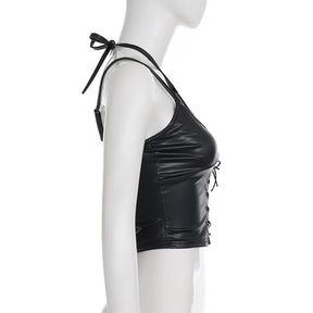 Side view of the black halter crop top on a mannequin, with the halter tie and short hem visible.