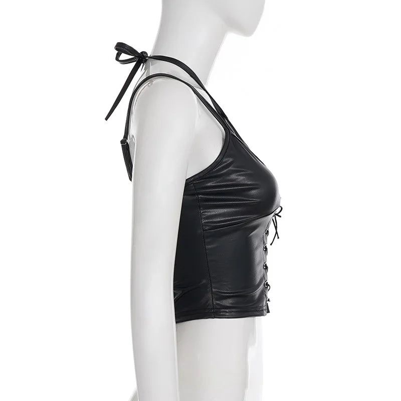 Side view of the black halter crop top on a mannequin, with the halter tie and short hem visible.