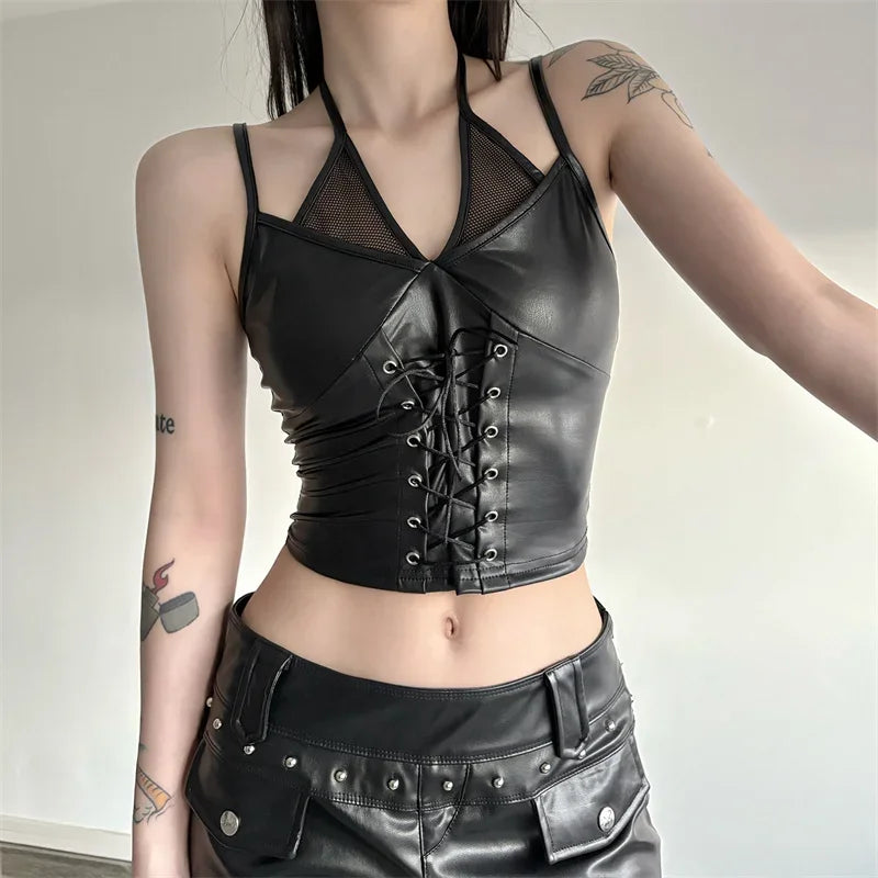 Square model view of the black lace-up crop top, with mesh neckline panels and thin halter straps above black shorts.