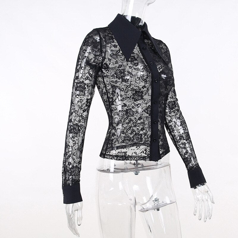 Angled mannequin view of the black lace blouse, with a solid collar and button placket contrasting against the sheer floral pattern.