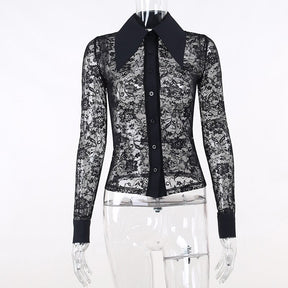 Black floral lace blouse on a clear mannequin, showing the pointed solid collar, button front, sheer body and wide cuffs without an underlayer.