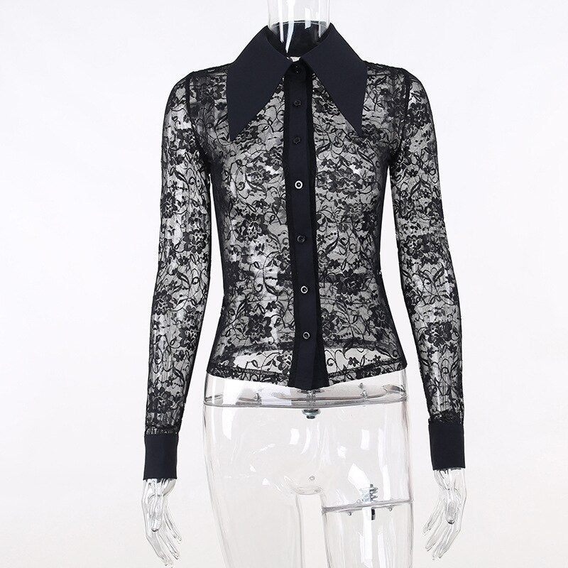 Black floral lace blouse on a clear mannequin, showing the pointed solid collar, button front, sheer body and wide cuffs without an underlayer.