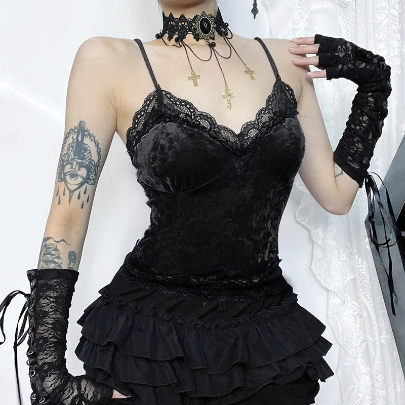 Angled front view of the black lace-trim camisole worn with a ruffled skirt and long floral lace arm warmers.