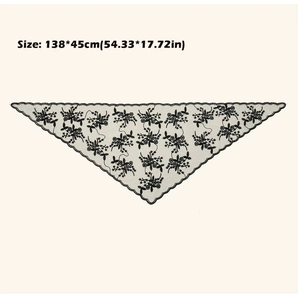 Black floral lace triangle headscarf spread flat on a pale background, with a supplier size annotation of 138 by 45 centimetres above it.