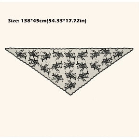 Black floral lace triangle headscarf spread flat on a pale background, with a supplier size annotation of 138 by 45 centimetres above it.