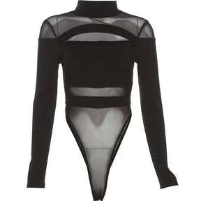 Black bodysuit displayed against white, showing the full long-sleeve shape, high neckline, oval chest opening, sheer panels and high-cut legs.