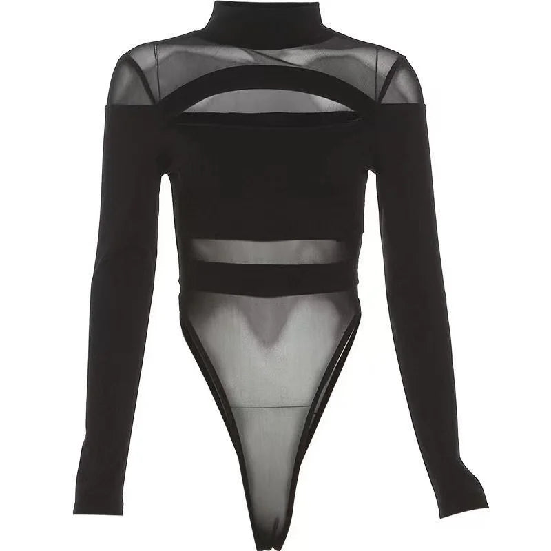 Black bodysuit displayed against white, showing the full long-sleeve shape, high neckline, oval chest opening, sheer panels and high-cut legs.