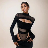 Black long sleeve mesh-panel bodysuit worn with black trousers, showing its high neckline, oval chest cutout, horizontal waist bands and high-cut lower section.