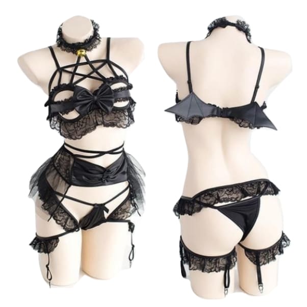 Two mannequin views of the black bat-wing lingerie set, showing the star-shaped chest straps and small wings across the back.