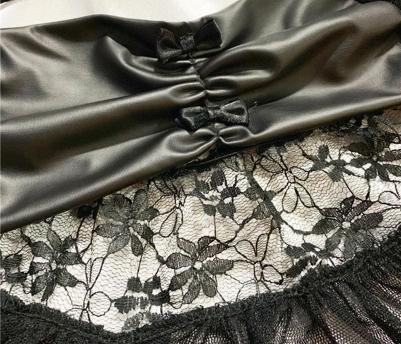 Detail of the lingerie set’s glossy ruched waist panel, small bows and floral lace ruffle.