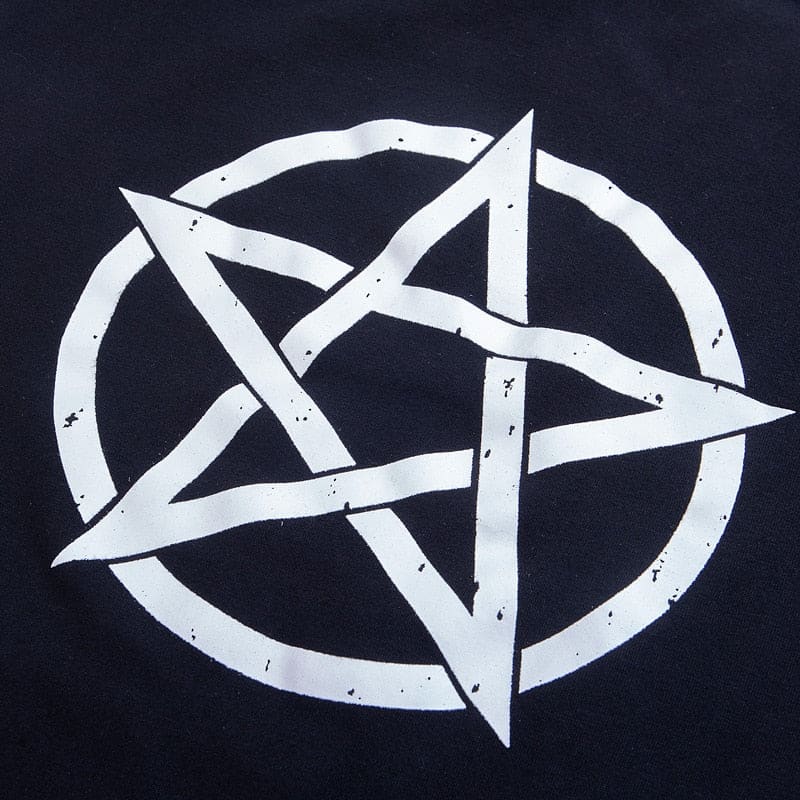 Detailed view of the distressed white pentagram and circular outline printed on the black gothic dress.
