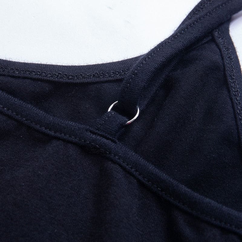 Close-up of the black dress strap attachment ring and stitching along the rounded back neckline.