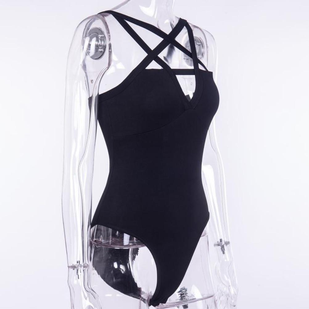 Black sleeveless pentagram bodysuit on a clear display form from a three-quarter angle, showing the open strap neckline and fitted front.