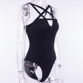 Black sleeveless pentagram bodysuit on a clear display form from a three-quarter angle, showing the open strap neckline and fitted front.