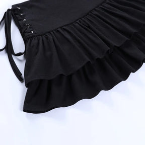 Black side lace-up skirt laid diagonally on white, displaying the two gathered ruffle tiers and broad waistband.