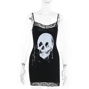 Front mannequin view of the black mini dress, showing the large pale skull, slender straps and floral lace at the neckline and hem.