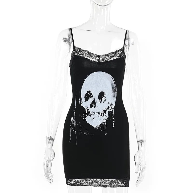 Front mannequin view of the black mini dress, showing the large pale skull, slender straps and floral lace at the neckline and hem.