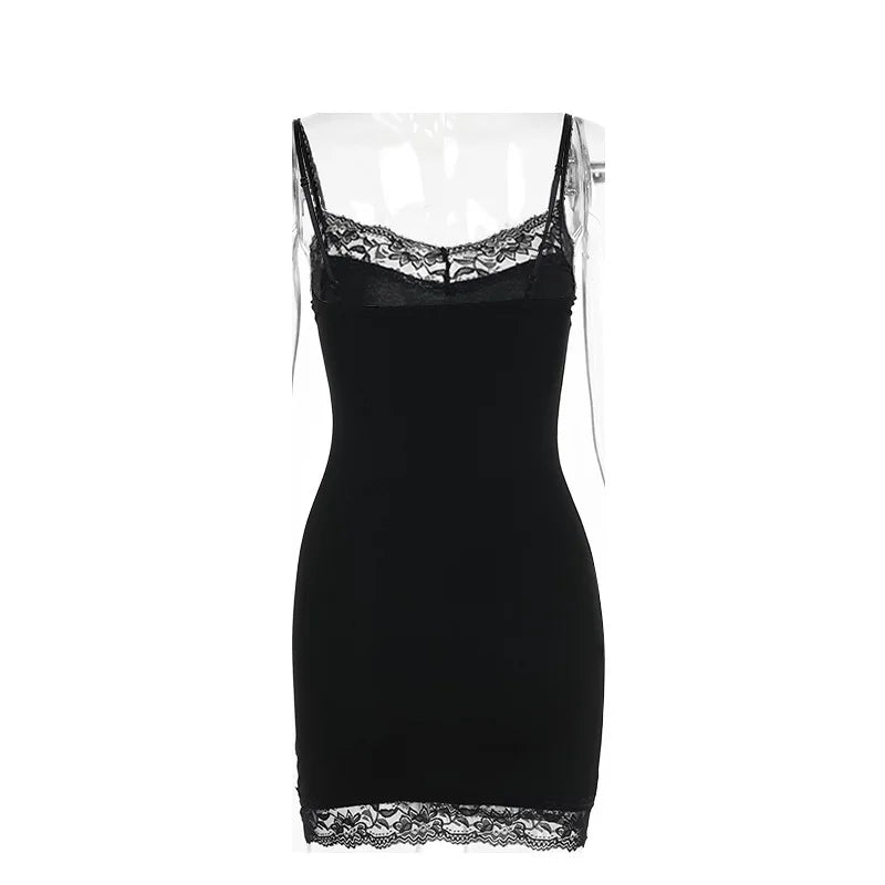 Plain back of the black mini dress isolated on white, showing the lace-trimmed top edge and hem.
