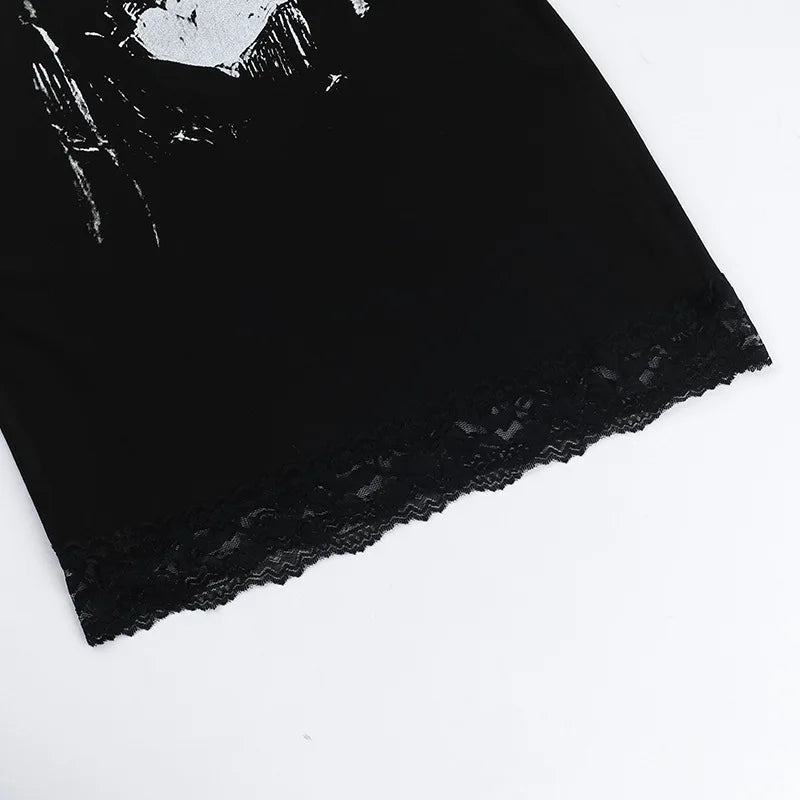 Close-up of the black dress's floral lace hem beneath the lower edge of the skull graphic.