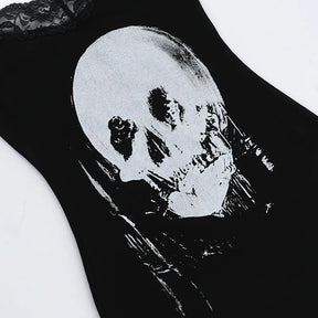 Close view of the distressed pale skull graphic printed on the black dress front.