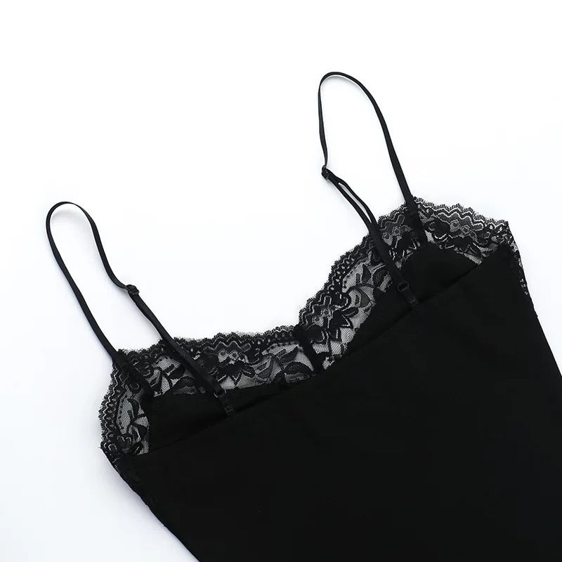 Upper section of the black dress laid flat, showing both slim straps and the lace neckline against white.