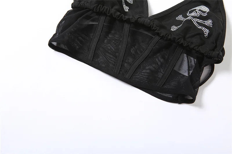 Lower section of the black skull top laid flat, showing transparent mesh panels divided by opaque vertical strips.