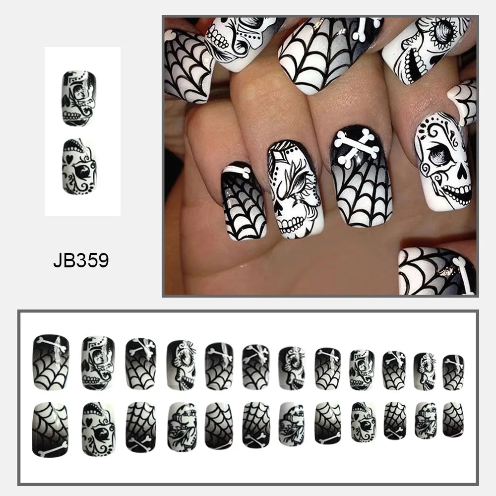 Black-and-white square nail design with decorated skulls, spiderwebs and crossed bone motifs, shown worn and arranged by size.