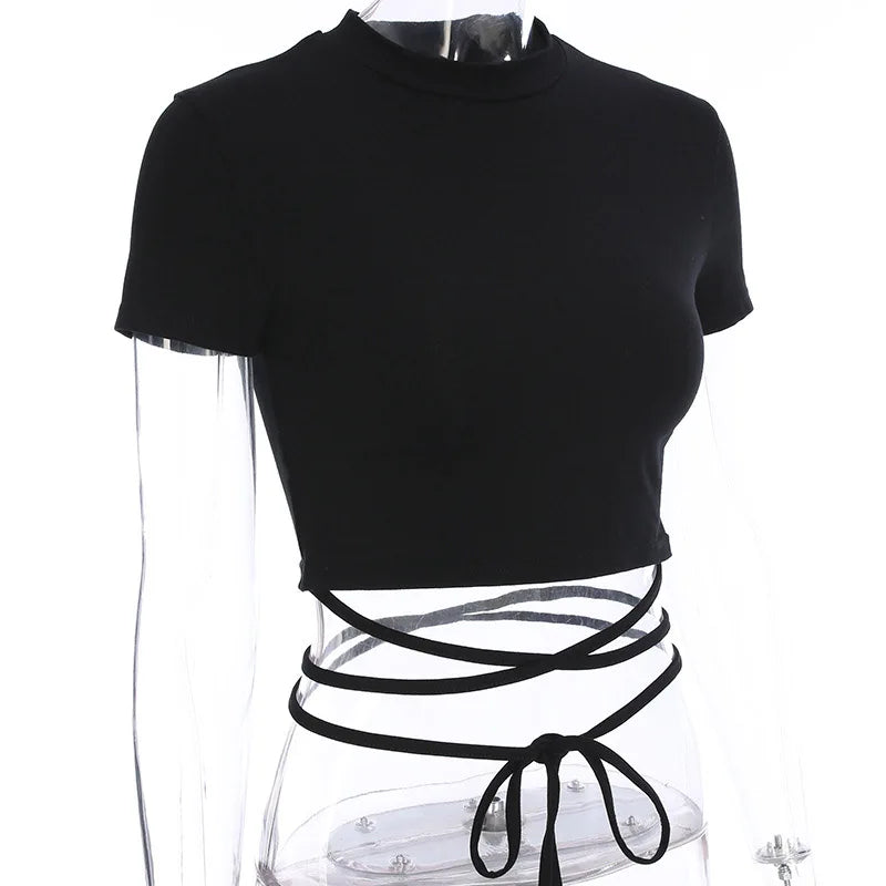 Angled mannequin view of the black short sleeve top, showing the cropped hem and wrap ties below it.