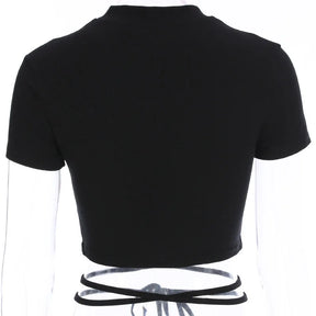 Rear mannequin view of the plain black crop top, with the waist ties crossing below the short back hem.