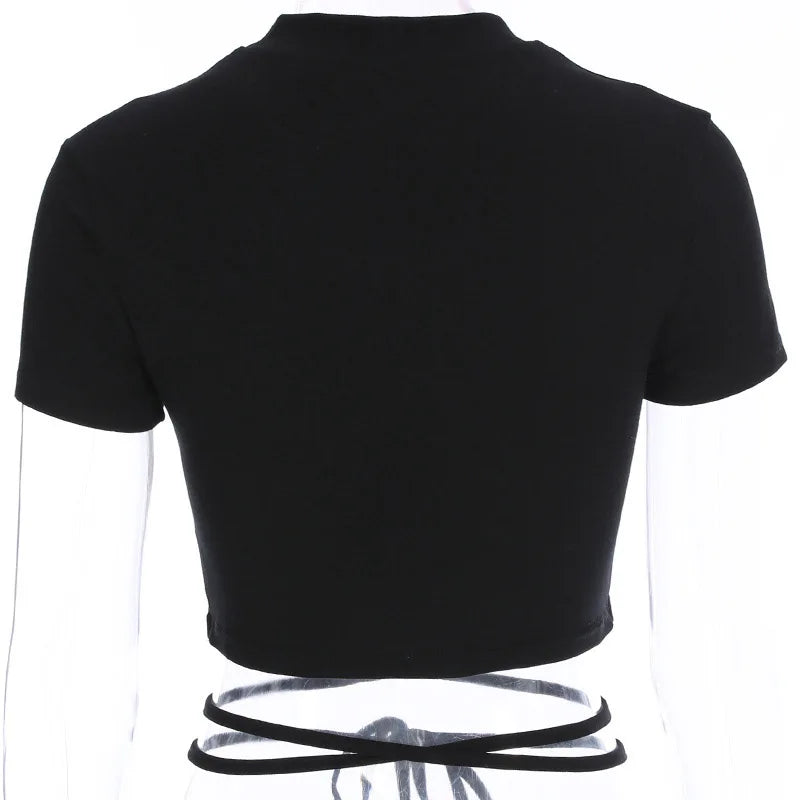 Rear mannequin view of the plain black crop top, with the waist ties crossing below the short back hem.