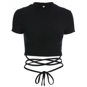 Front view of the black short sleeve crop top isolated on white, with wrap ties crossed below the hem and a bow at the waist.